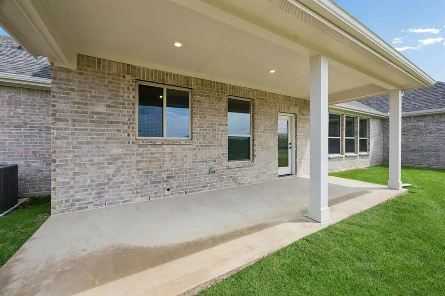 Exterior details and patio area of a home in Ellis Ranch Estates, Waxahachie (Image 21).