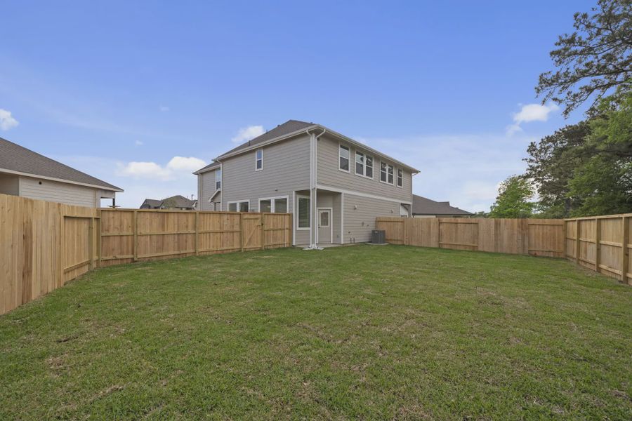 Exterior details and patio area of a home in Woodforest, Montgomery (Image 3).