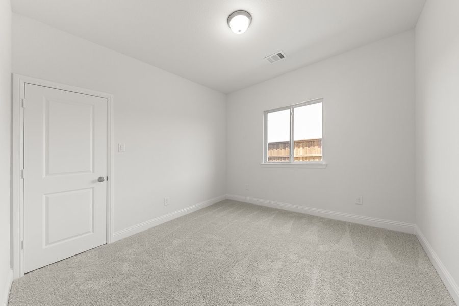 Spacious, unfurnished interior of a new home in The Reserve at Spiritas Ranch, Little Elm (Image 28).