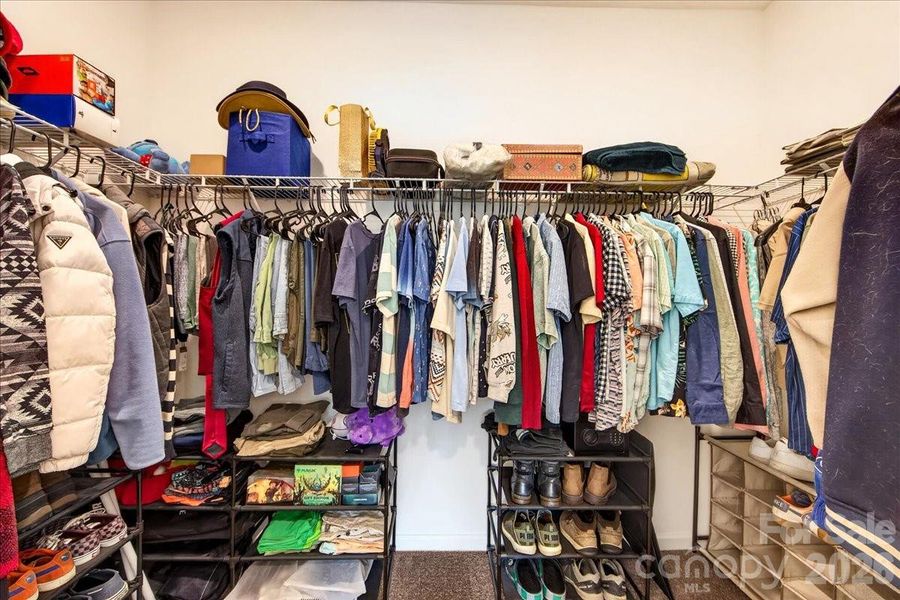 Primary walk in closet Primary walk in closet