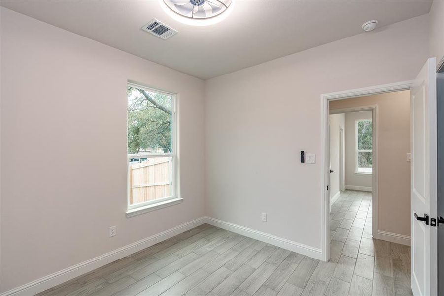 Bedroom with light hardwood / wood-style floors