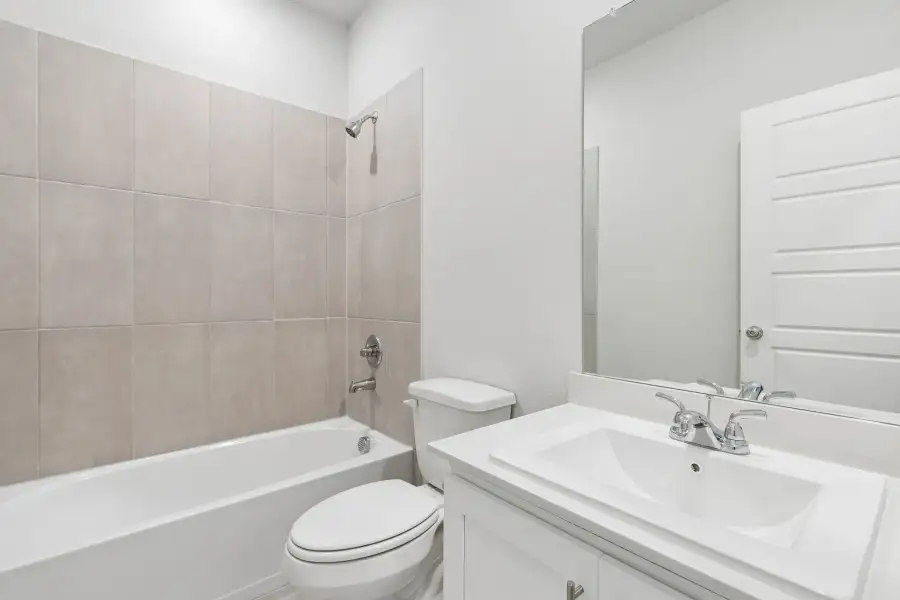 Bathroom in the Cypress home plan by Trophy Signature Homes - REPRESENTATIVE PHOTO