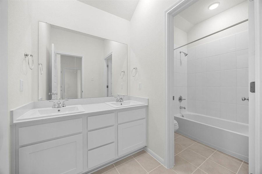 Bathroom in the Magnolia home plan by Trophy Signature Homes – REPRESENTATIVE PHOTO