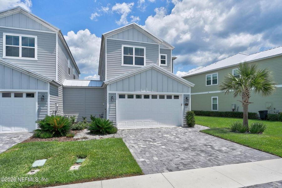 Front exterior of a new home in , St. Johns, FL, highlighting curb appeal (Image 22). Front exterior of a new home in , St. Johns, FL, highlighting curb appeal (Image 22).