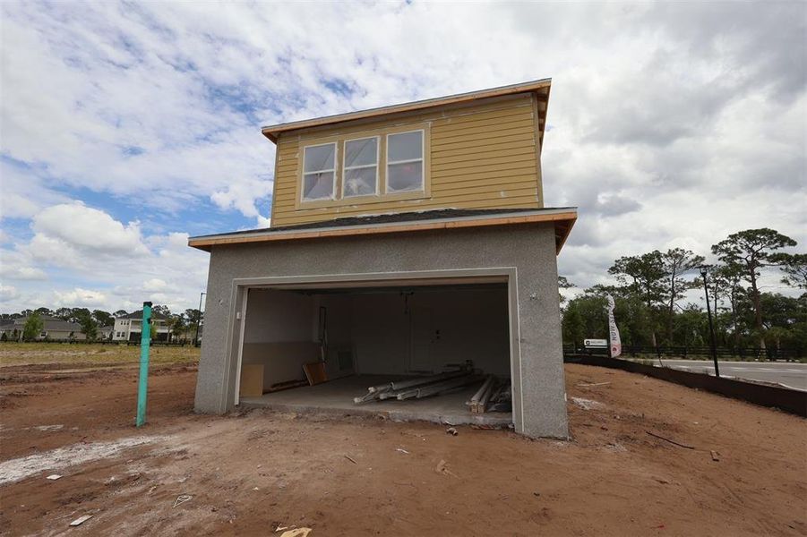 In-progress construction of a new home in Center Lake on the Park, St. Cloud, FL (Image 13).