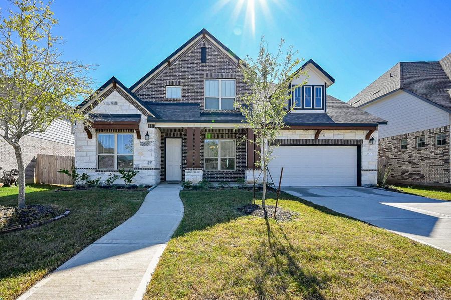 Front exterior of a new home in StoneCreek Estates, Richmond, TX, highlighting curb appeal (Image 28).