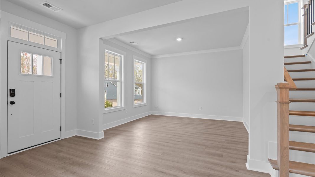 Thoughtful design meets architectural elegance in this coffered ceiling dining room