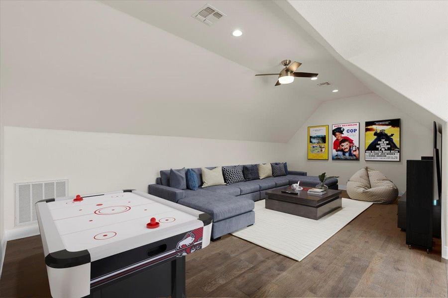 Virtually Staged Recreation room featuring dark wood-style floors, lofted ceiling, ceiling fan, and recessed lighting