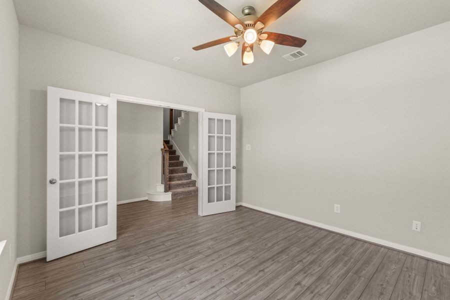 An additional view of the study and French doors