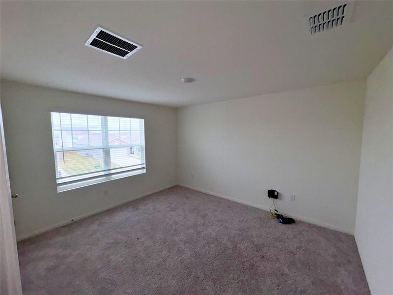 Spare room with carpet and baseboards Spare room with carpet and baseboards