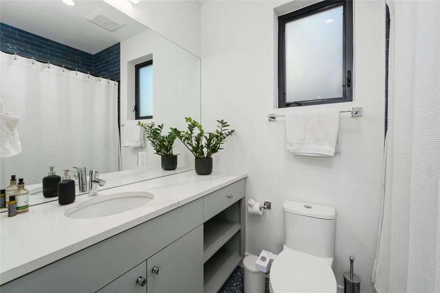 Garage apt full bath with cool subway tile sub surround