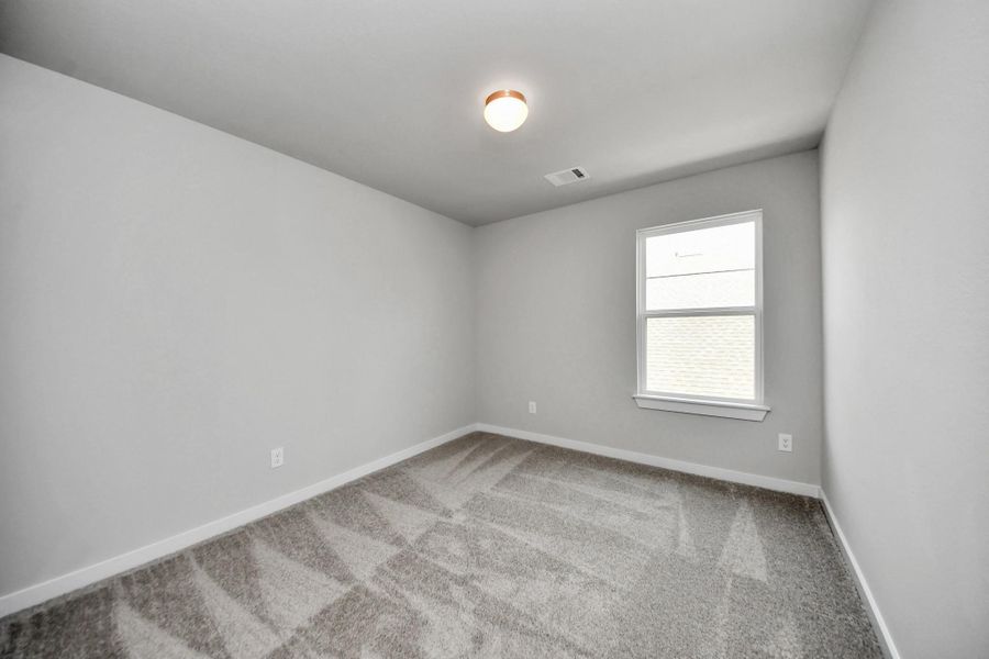 Secondary bedroom features plush carpeting, large windows that let in plenty of natural light, bright paint, and spacious closets. Secondary bedroom features plush carpeting, large windows that let in plenty of natural light, bright paint, and spacious closets.