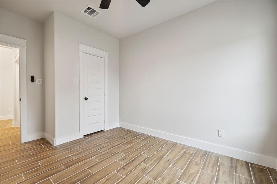 Unfurnished bedroom featuring ceiling fan