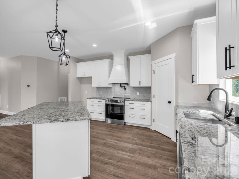 Chef's kitchen with granite counters and stainless appliances (convection electric oven, microwave drawer and dishwasher), stainless appliances, soft close cabinets and large walk-in pantry. Chef's kitchen with granite counters and stainless appliances (convection electric oven, microwave drawer and dishwasher), stainless appliances, soft close cabinets and large walk-in pantry.