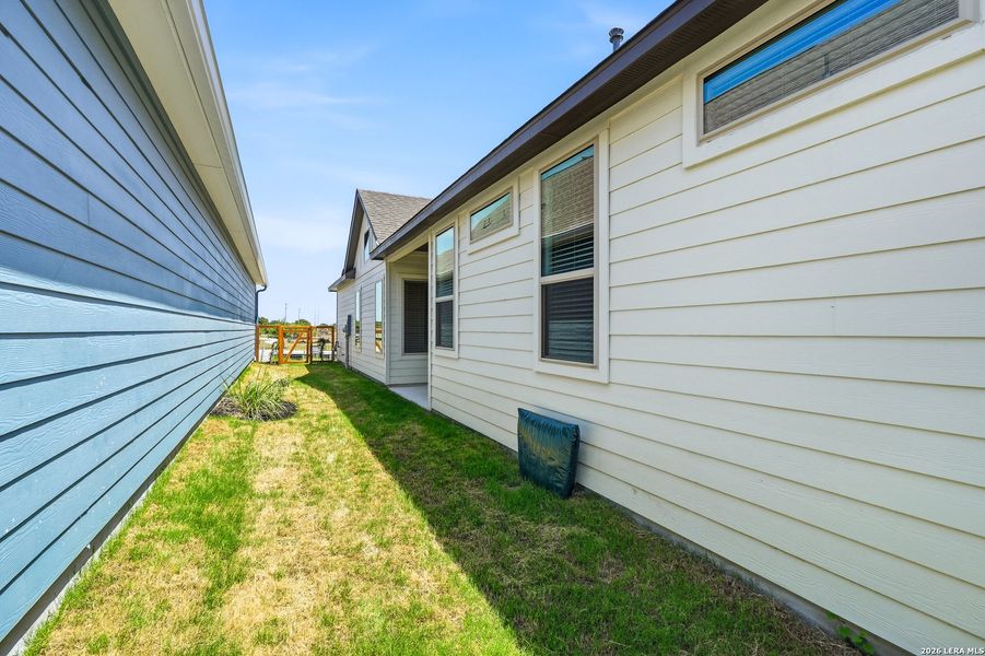 Exterior details and patio area of a home in The Crossvine, Schertz (Image 3).