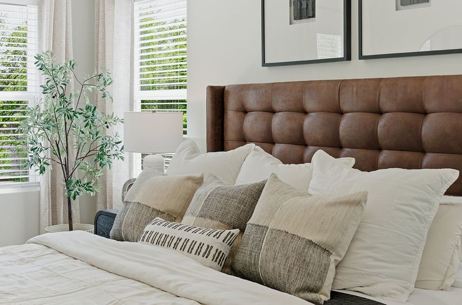 A couch with pillows.