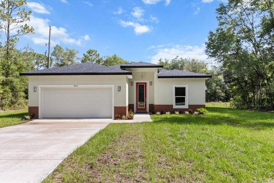 Front exterior of a new home in , Citrus Springs, FL, highlighting curb appeal (Image 1). Front exterior of a new home in , Citrus Springs, FL, highlighting curb appeal (Image 1).