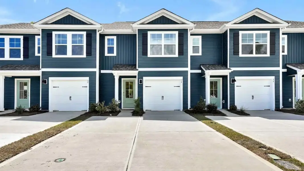 Front exterior of a new home in The Willows at Blake Farm EXP, Wilmington, NC, highlighting curb appeal (Image 1). Front exterior of a new home in The Willows at Blake Farm EXP, Wilmington, NC, highlighting curb appeal (Image 1).