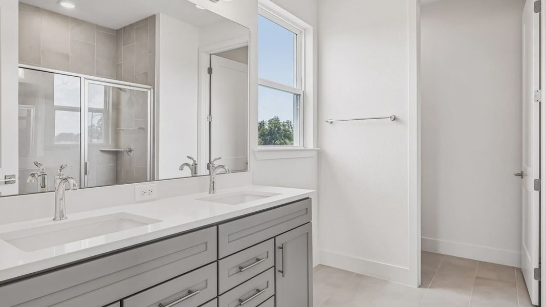 Longleaf Floor Plan Primary Suite Bath with Dual Sink Vanity by DRB Homes Lakeside at Satilla in New Homes St. Cloud