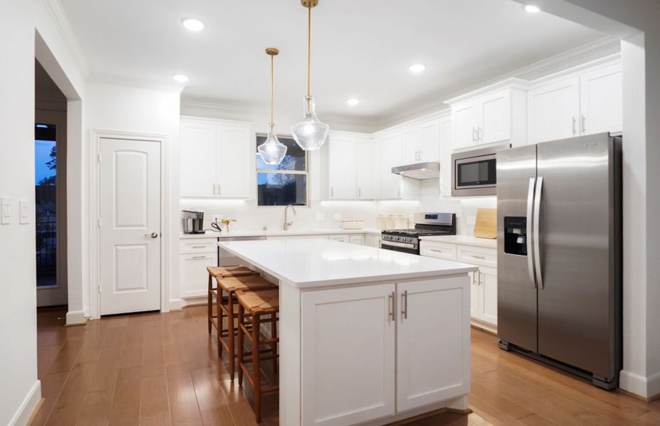 Representative furnished interior of a home built from the Flagstone by DiVosta in BeachWalk by Manasota Key, Englewood (Image 14).