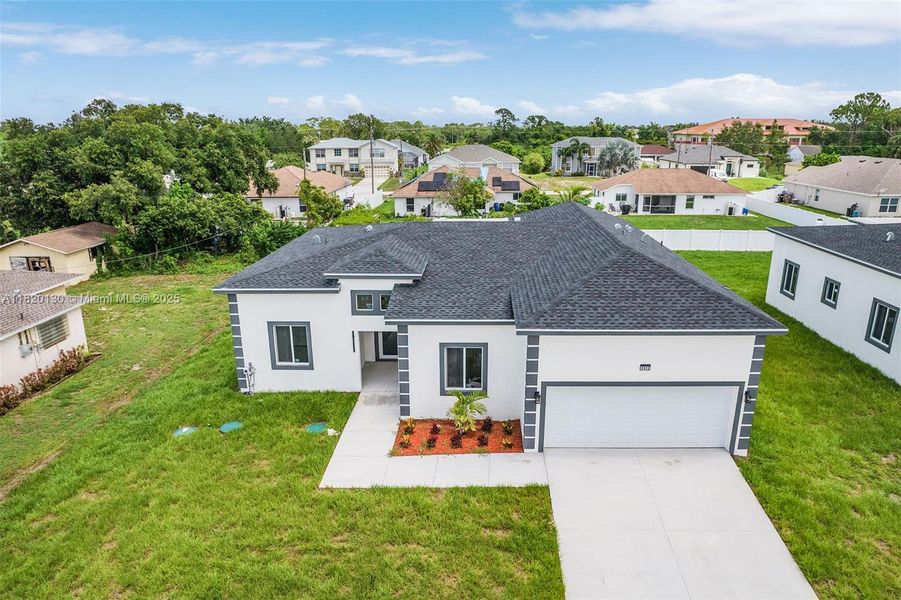 Front exterior of a new home in , Lehigh Acres, FL, highlighting curb appeal (Image 16).