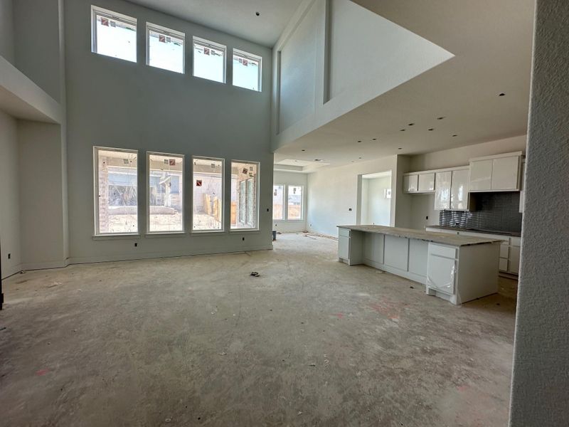 Family Room with soaring ceiling to Kitchen & Casual Dining