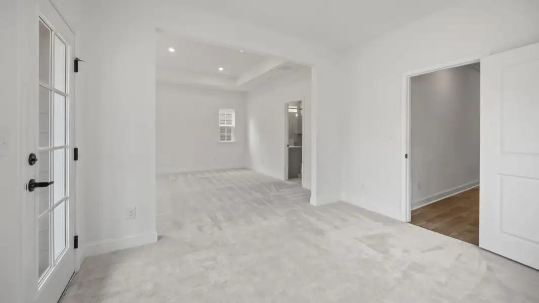 The Brentwood Plan by DRB Homes in River District, Charlotte NC.- Primary Bedroom with Sitting Area