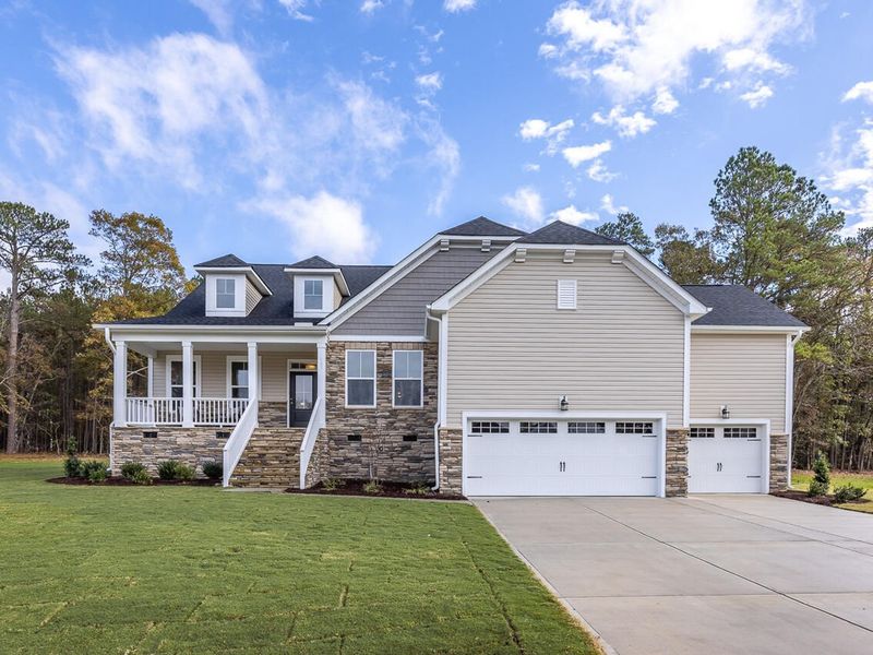 Front exterior of a new home in Tobacco Road, Angier, NC, highlighting curb appeal (Image 2). Front exterior of a new home in Tobacco Road, Angier, NC, highlighting curb appeal (Image 2).