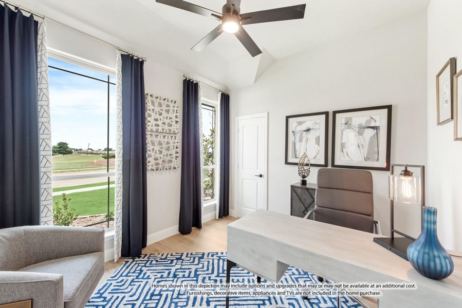 Home office with vaulted ceiling, ceiling fan, large windows, and hardwood floors Home office with vaulted ceiling, ceiling fan, large windows, and hardwood floors
