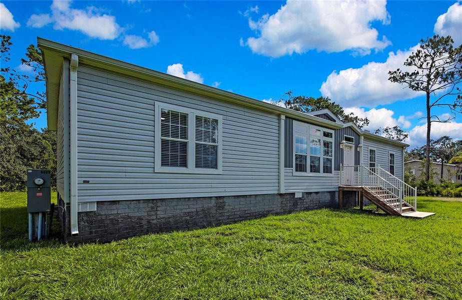 Front exterior of a new home in , Homosassa, FL, highlighting curb appeal (Image 23).