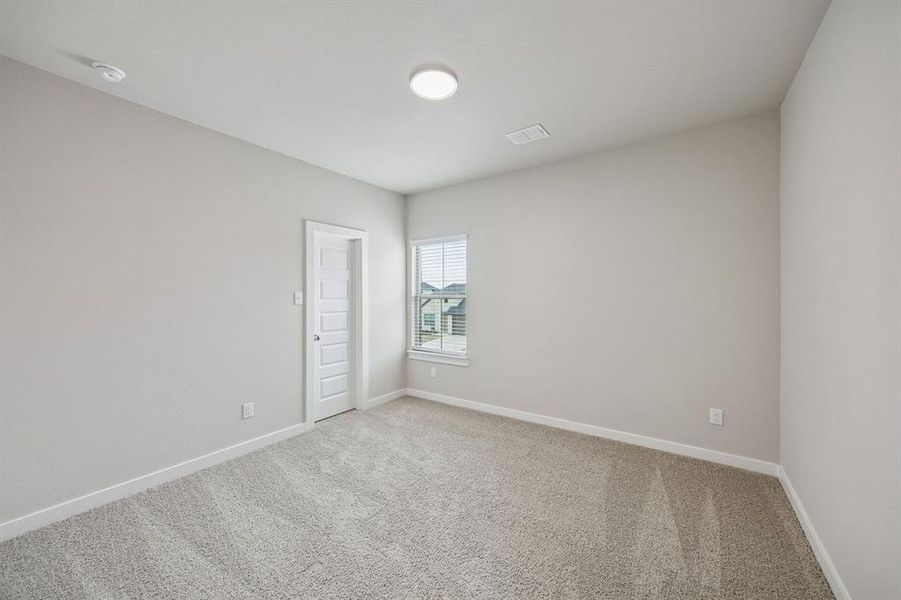 Bedroom in the Stanley II home plan by Trophy Signature Homes – REPRESENTATIVE PHOTO