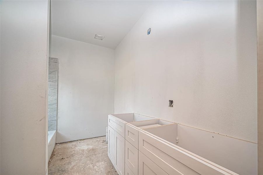 The primary bathroom is set to impress with an extended vanity area, ideal for maximizing counter space.