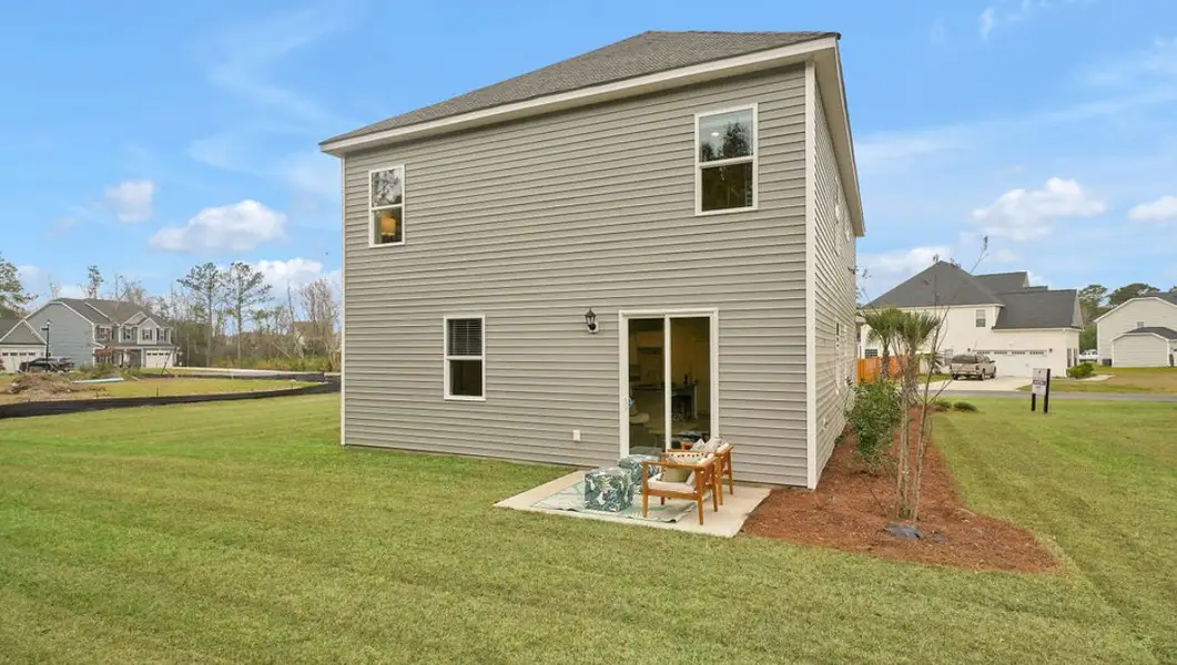 Exterior details and patio area of a home in Surfside Landing, Hubert (Image 2). Exterior details and patio area of a home in Surfside Landing, Hubert (Image 2).