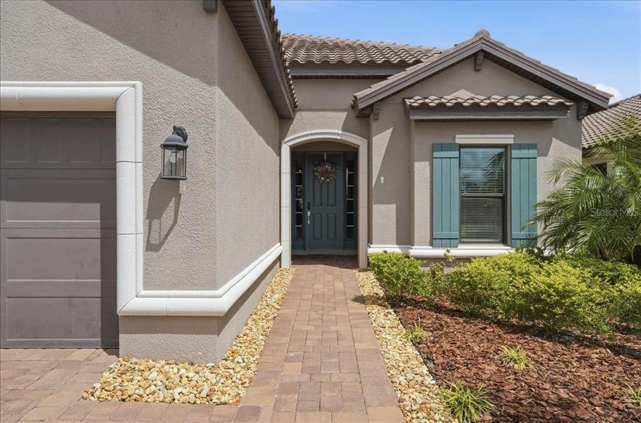 Exterior details and patio area of a home in Esplanade at Artisan Lakes, Palmetto (Image 25).