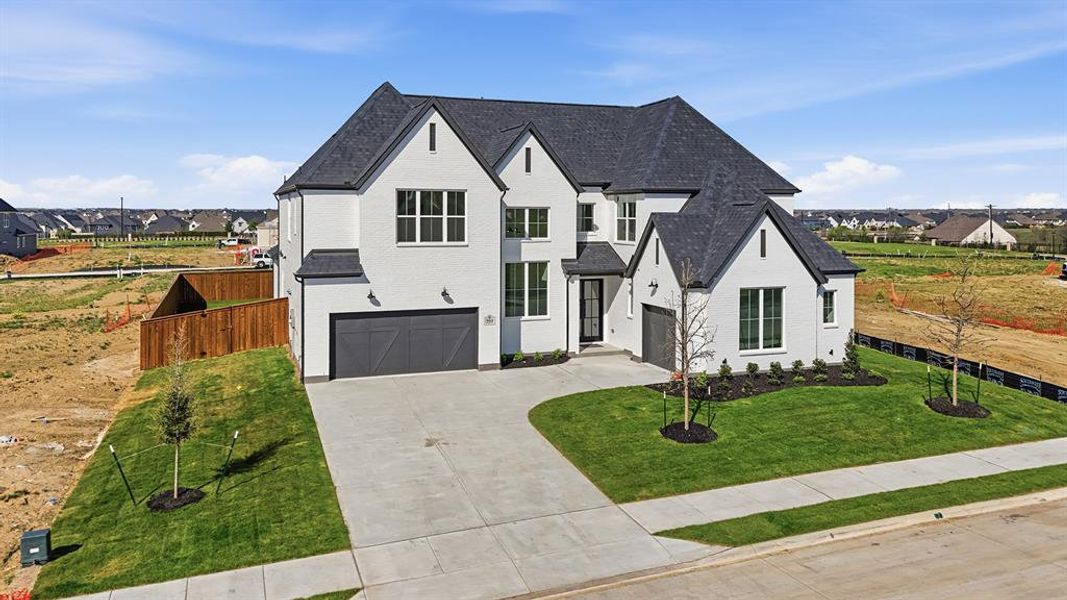 Front exterior of a new home in , Prosper, TX, highlighting curb appeal (Image 2). Front exterior of a new home in , Prosper, TX, highlighting curb appeal (Image 2).