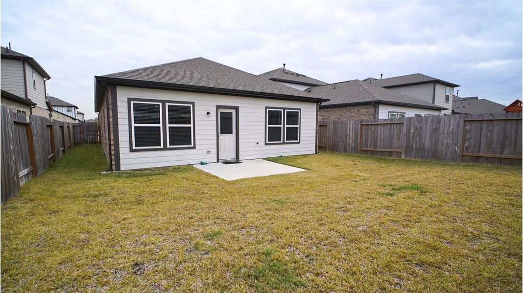 Exterior details and patio area of a home in Lonestar Collection at Aurora, Katy (Image 22).