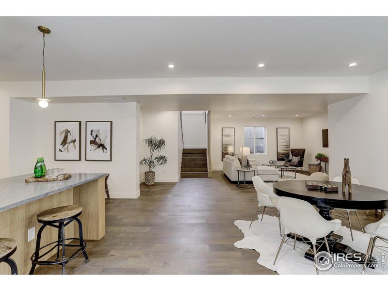 The light and bright lower-level features an entertaining space with an expansive wet bar.