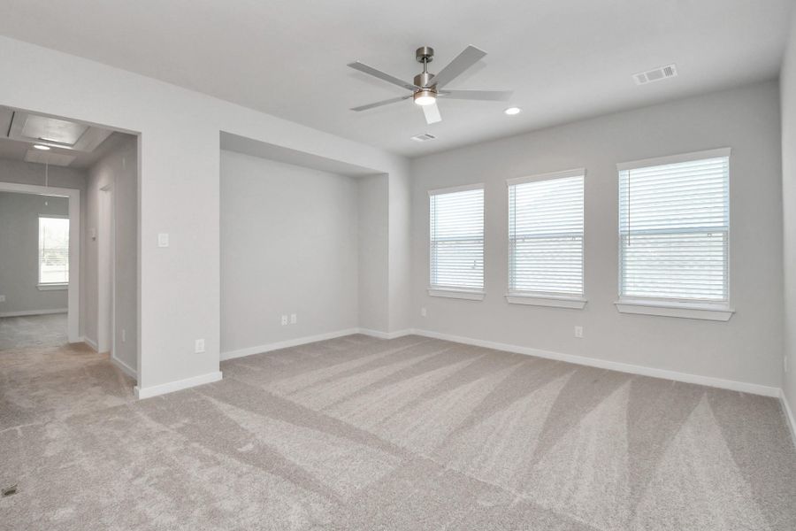 Ascend to relaxation in this fantastic game room! Ideal for both casual gatherings and adult gaming, it boasts plush carpet, lofty ceilings, custom paint, and ample windows for abundant natural light Ascend to relaxation in this fantastic game room! Ideal for both casual gatherings and adult gaming, it boasts plush carpet, lofty ceilings, custom paint, and ample windows for abundant natural light