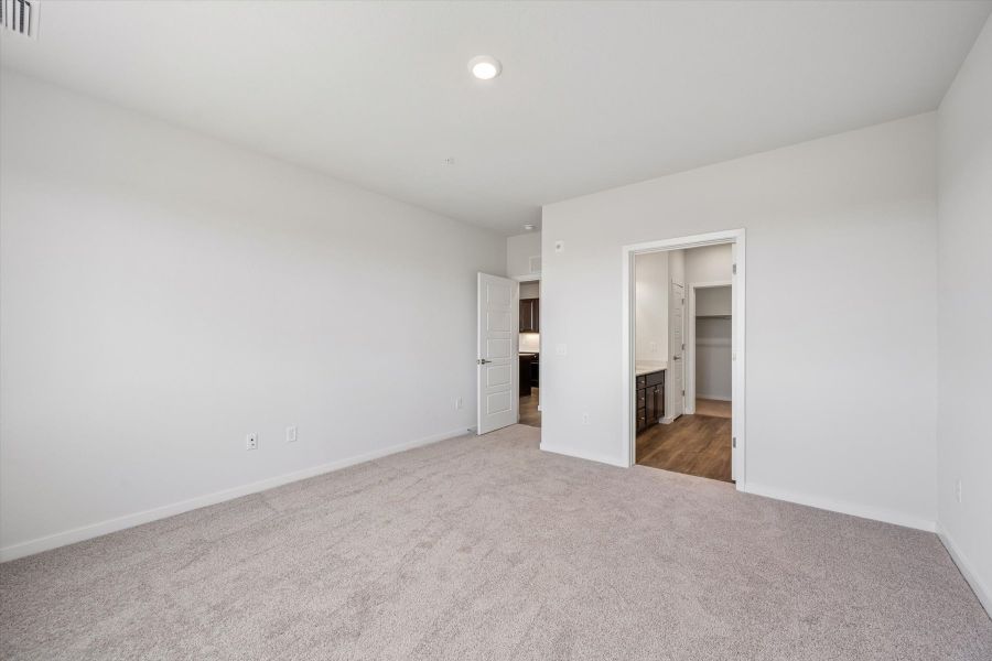 A hallway with white walls.
