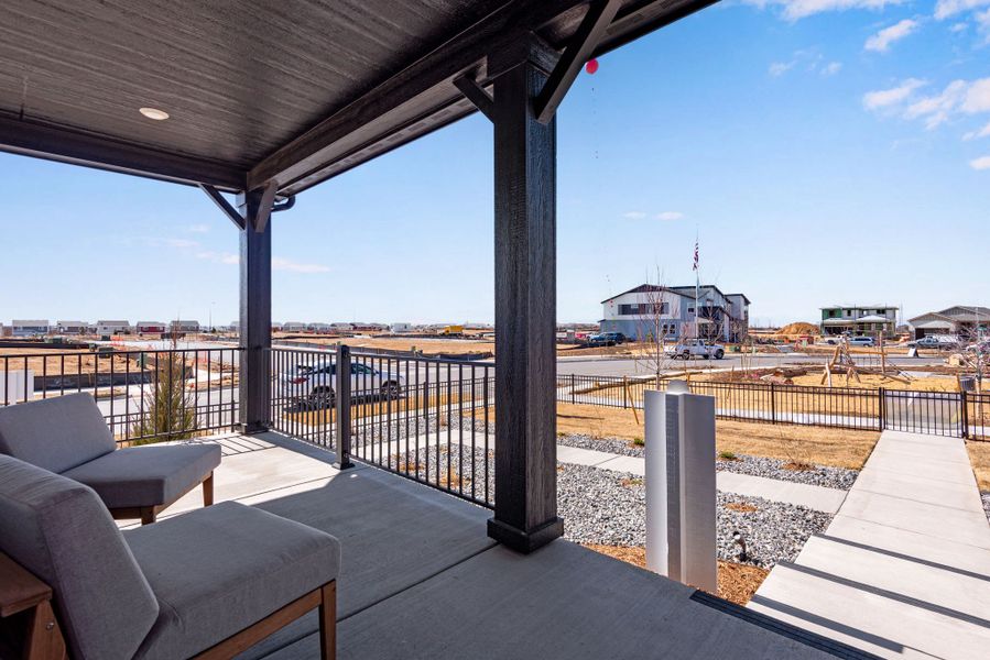 Exterior details and patio area of a home in Painted Prairie, Aurora (Image 19).
