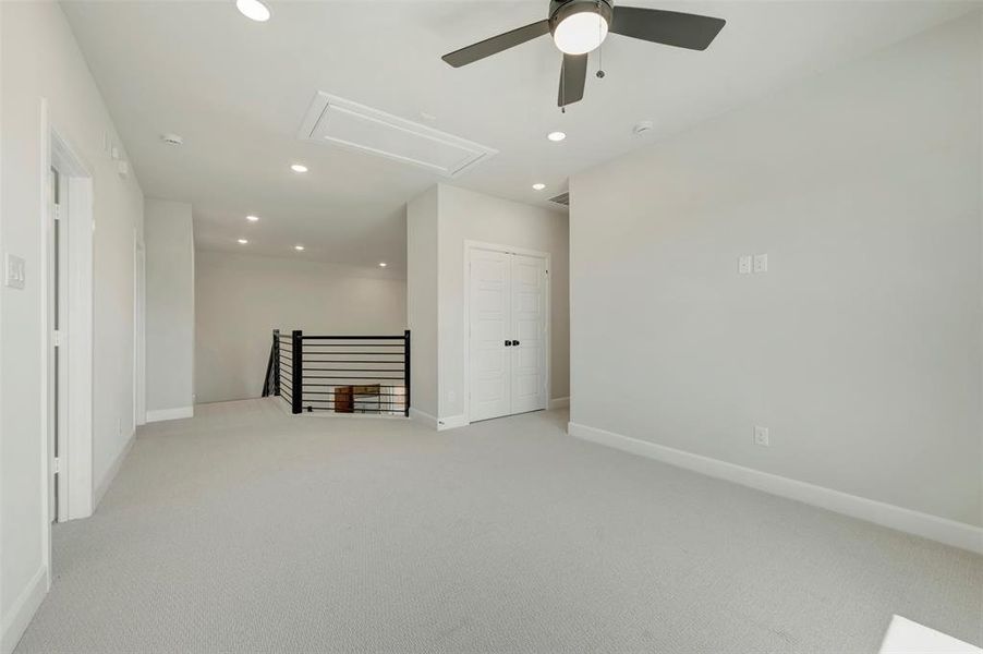 Spare room featuring light colored carpet, recessed lighting, and a ceiling fan