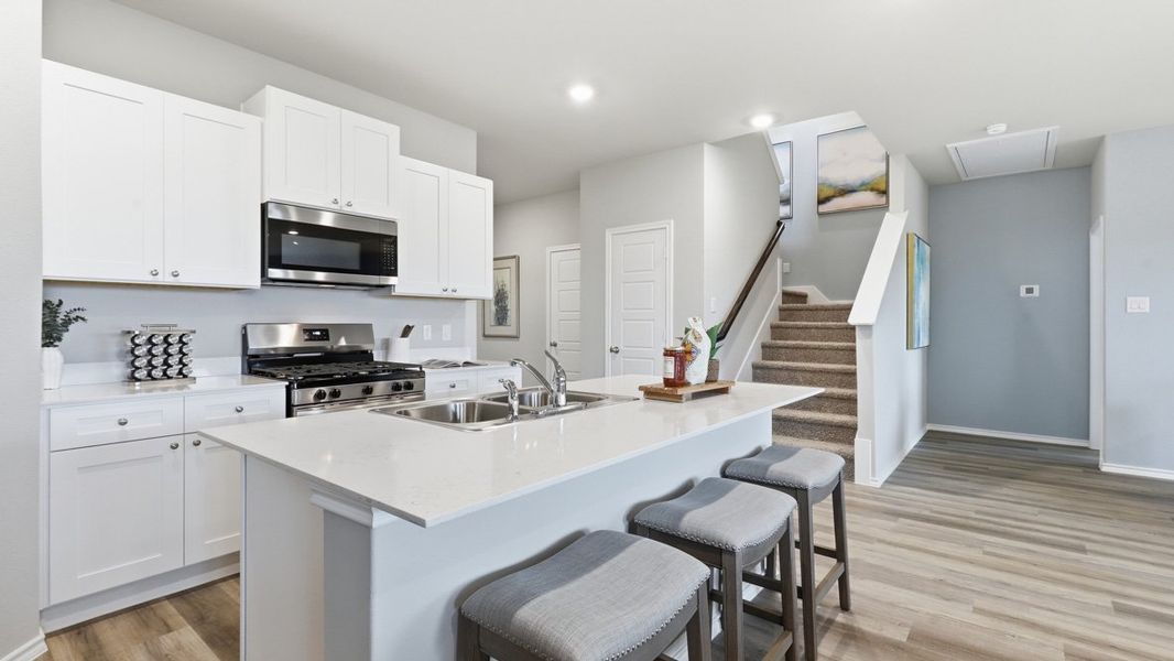 Representative furnished interior of a home built from the Plan by D.R. Horton in Bella Vista, Granbury (Image 4).