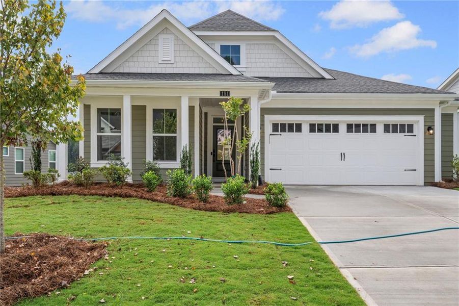 Front exterior of a new home in The Reserve At Liberty Park, Braselton, GA, highlighting curb appeal (Image 23). Front exterior of a new home in The Reserve At Liberty Park, Braselton, GA, highlighting curb appeal (Image 23).