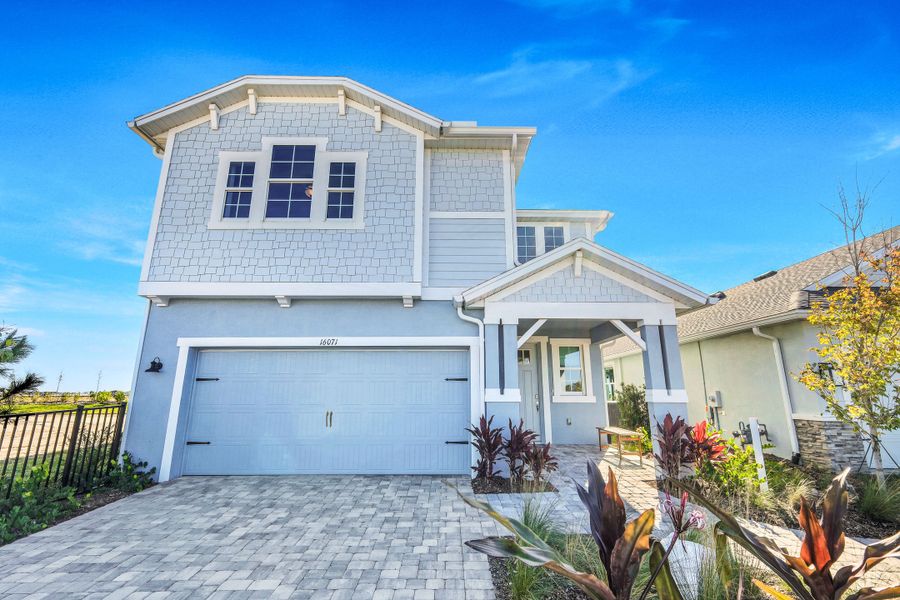 Representative exterior photo of a completed home built from the Sebring by William Ryan Homes in The Sanctuary – Coastal Collection, Punta Gorda, FL (Image 26).