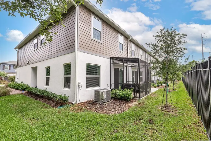 Exterior details and patio area of a home in Towns at Tuskawilla Commons, Oviedo (Image 2).