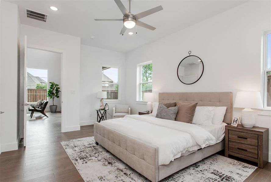 Bedroom with dark wood-type flooring and ceiling fan