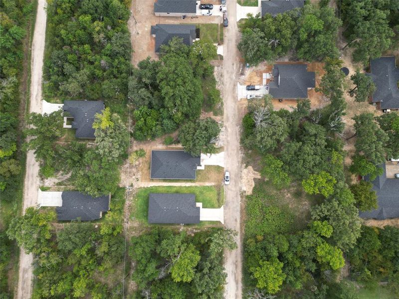 Aerial view of property and surrounding area featuring nearby suburban area Aerial view of property and surrounding area featuring nearby suburban area