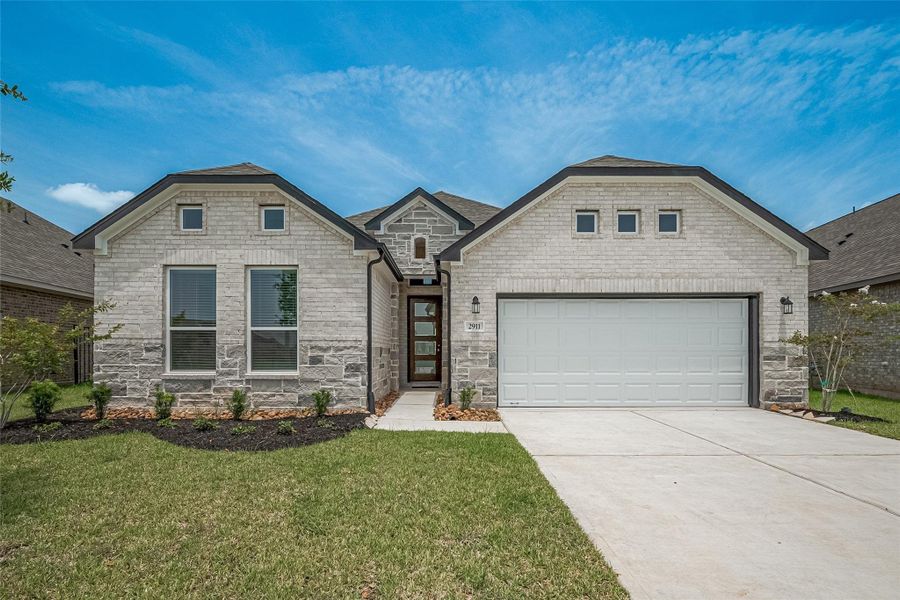 Front exterior of a new home in Lago Mar, Texas City, TX, highlighting curb appeal (Image 27).