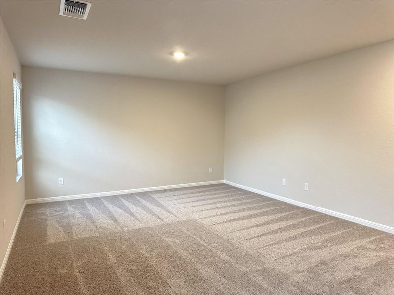 Carpeted loft with baseboards