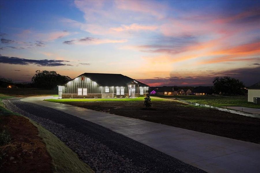 Front exterior of a new home in , Springtown, TX, highlighting curb appeal (Image 1). Front exterior of a new home in , Springtown, TX, highlighting curb appeal (Image 1).